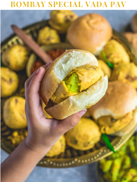 a hand holding a vada pav and text on top