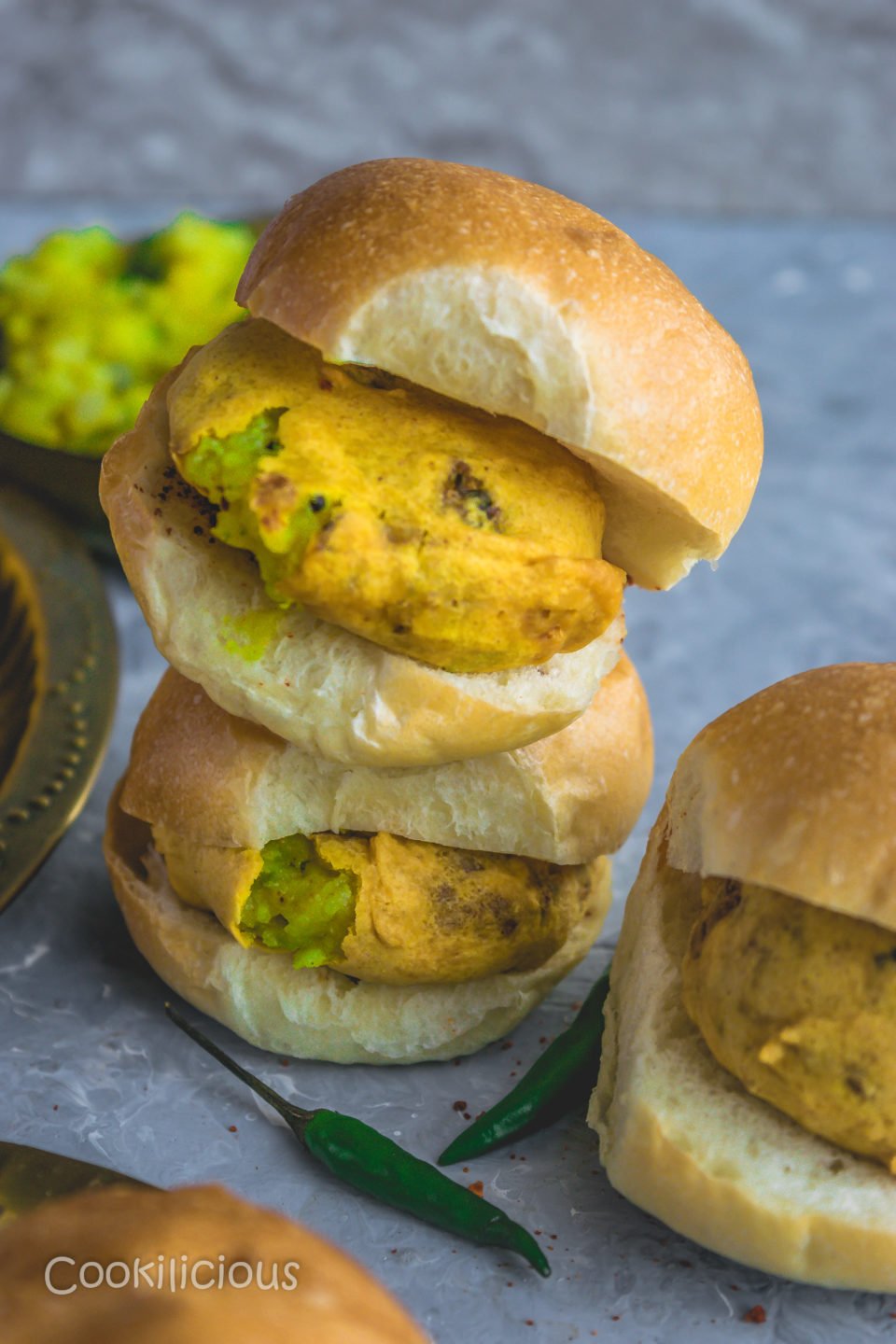 2 vada pav stacked one on top of the other