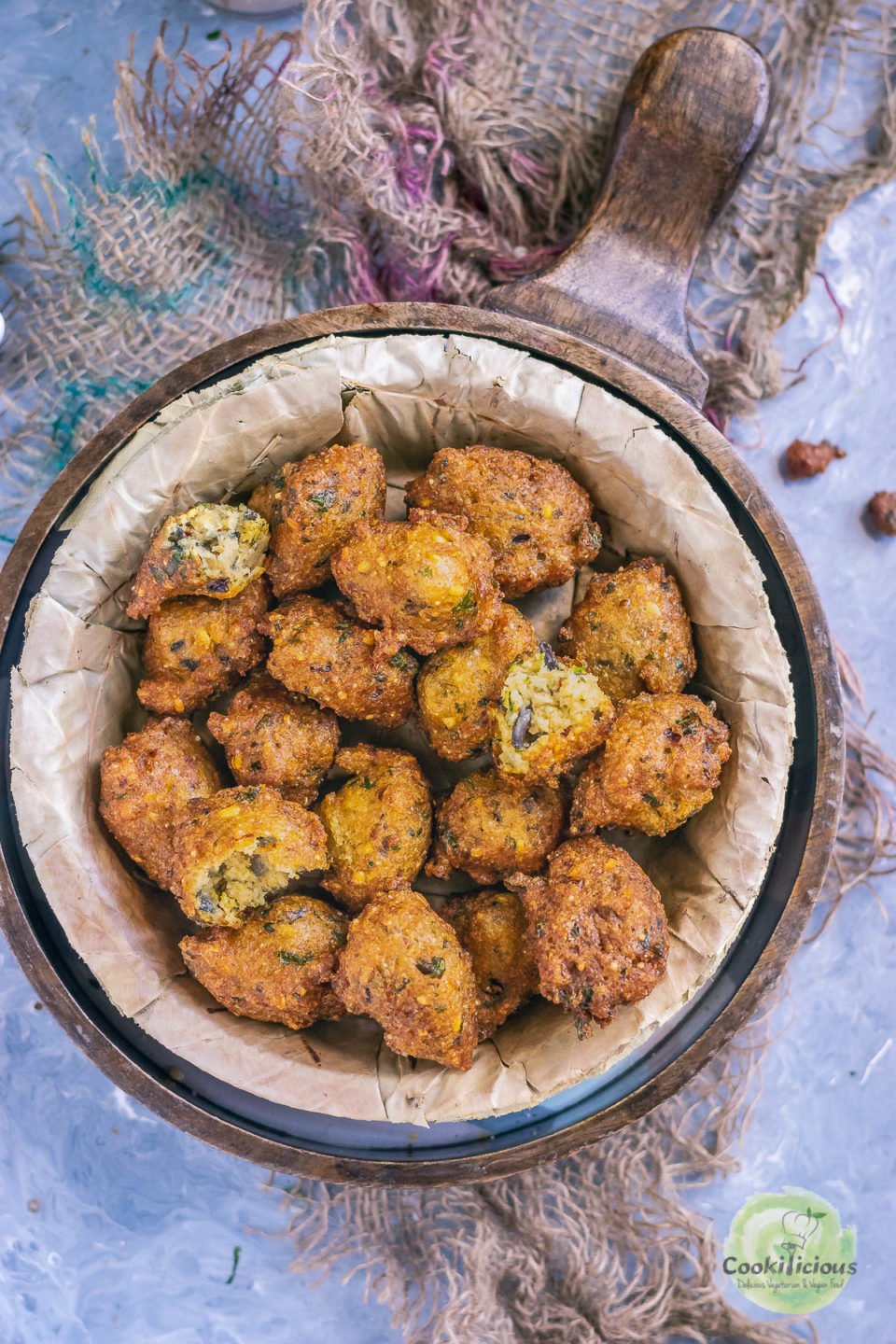 a bowl filled with Crispy Moong Dal Pakora (one of the popular easy vegan appetizers) 