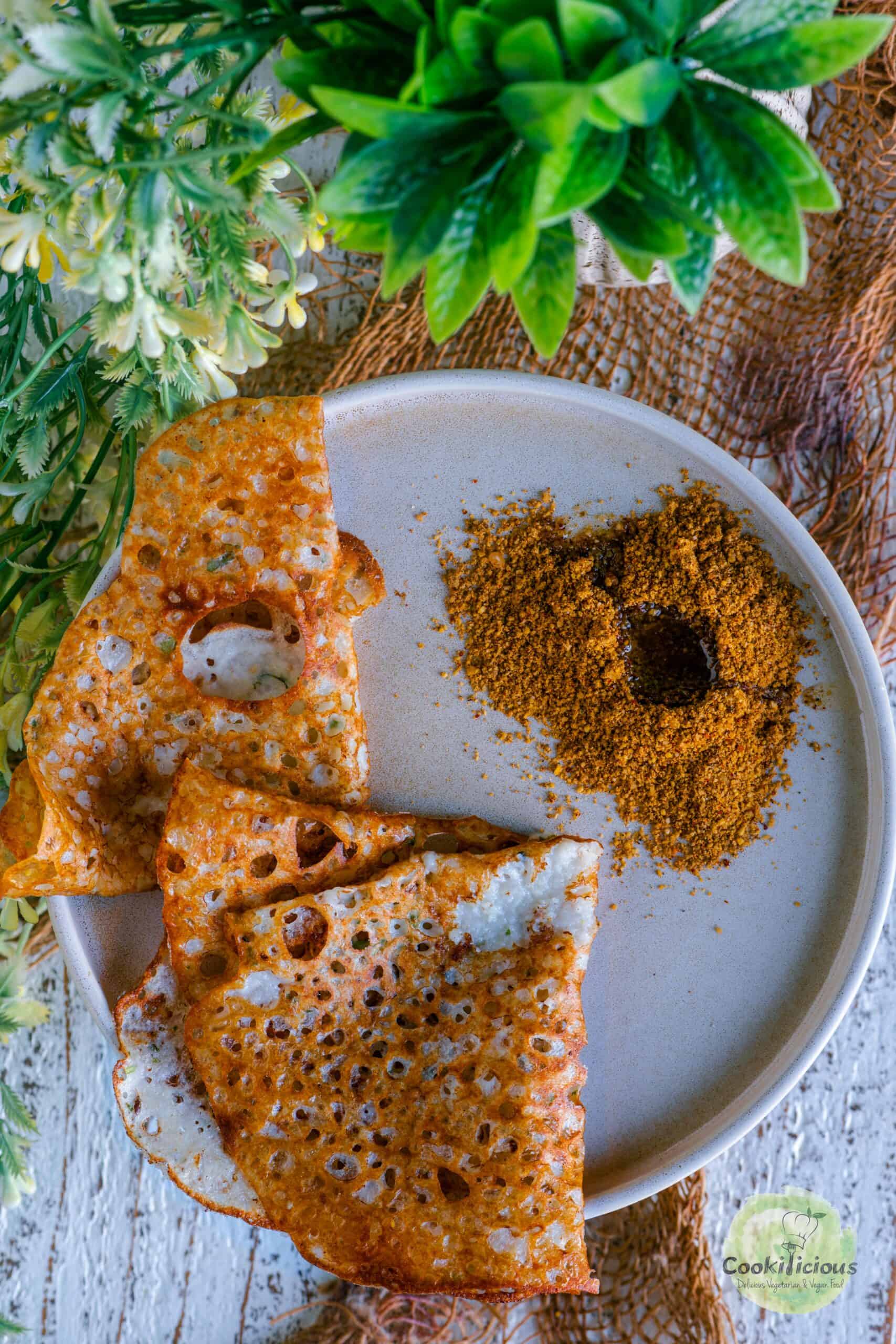 Milagai podi served with Indian sesame oil as a side for dosa.