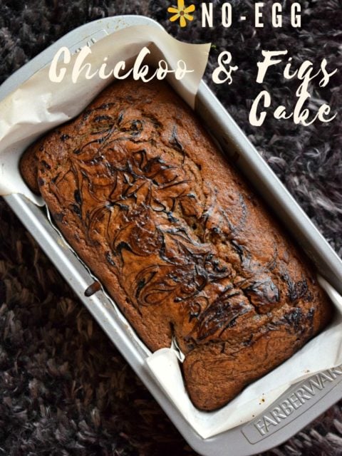 Eggless Chickoo Fig Loaf Cake still in the loaf pan with text at the top