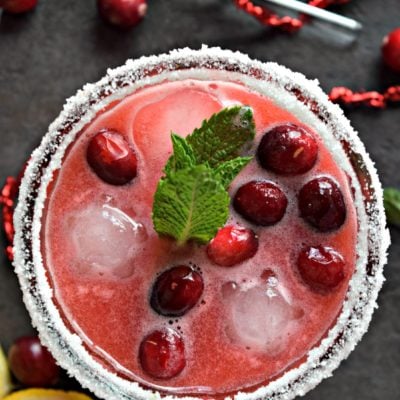 Amortentia in a glass with floating cherries on top