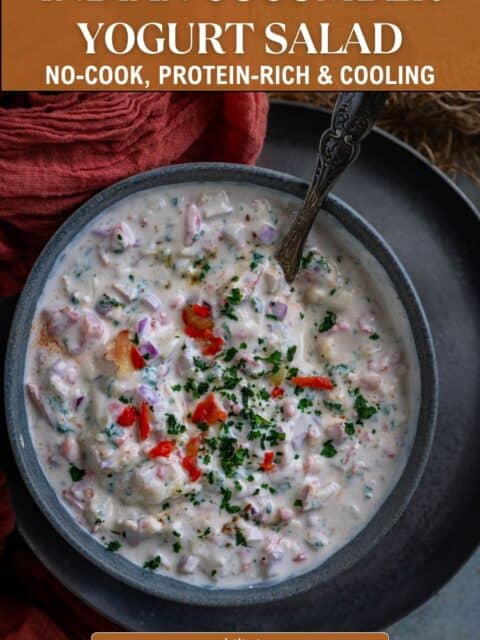 Pinterest pin graphic reading "Indian Cucumber Yogurt Salad, No-Cook, Protein-Rich & Cooling" over a bowl of koshimbir garnished with red pepper and cilantro.