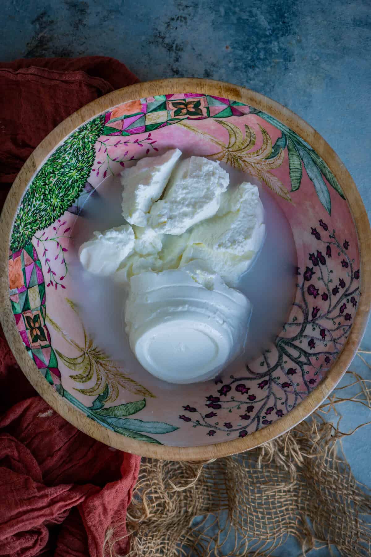 Whisking yogurt and water in a bowl for Maharashtrian koshimbir salad.