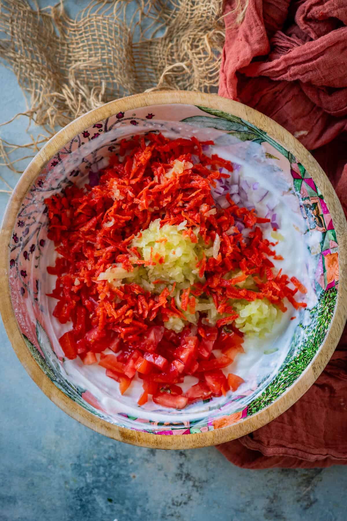 Grated cucumber and carrot stirred into yogurt for Maharashtrian salad.