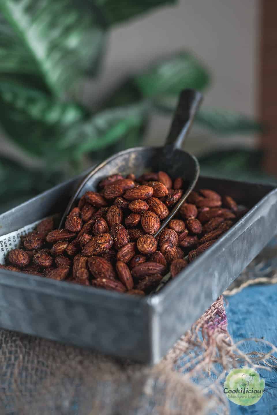 a rectangular tin filled with Smoky Spicy Garlic Roasted Almonds