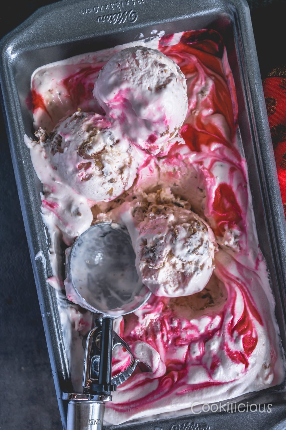3 Scoops of Loaf pan filled with No-Churn Rose Gulkand Ice Cream in a loaf pan