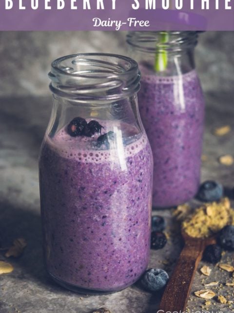 close up image of 2 glasses of Vegan Blueberry Pancake Almond Milk Smoothie placed one behind the other, and text at the top
