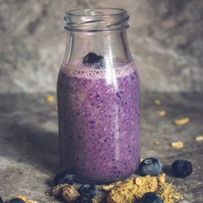 Front view of a glass filled with Vegan Blueberry Pancake Almond Milk Smoothie