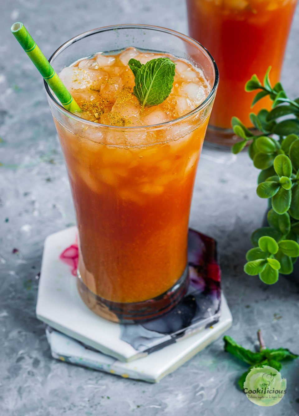 a tall glass filled with watermelon juice recipe - Sugar Free Drink garnished with mint leaves
