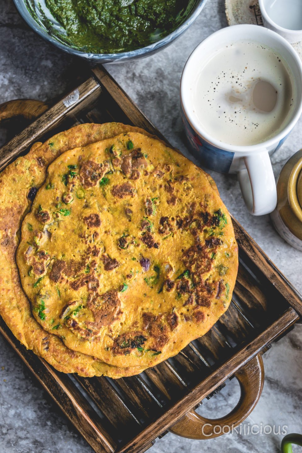 2 Tomato Omelette in a tray with a coffee mug next to it