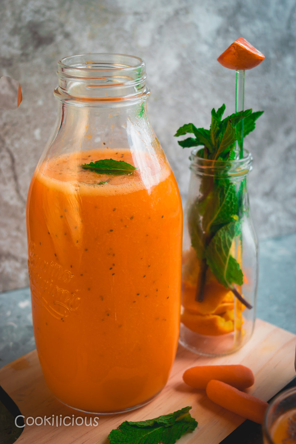 close up shot of a tall bottle filled with Immune Boosting Sunshine Smoothie