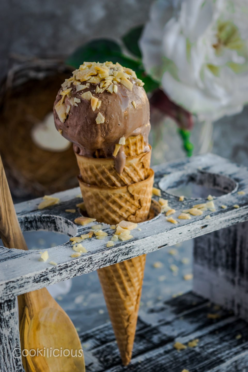 Coconut Chocolate Dairy-Free Ice Cream cone with coconut chips sprinkled on top