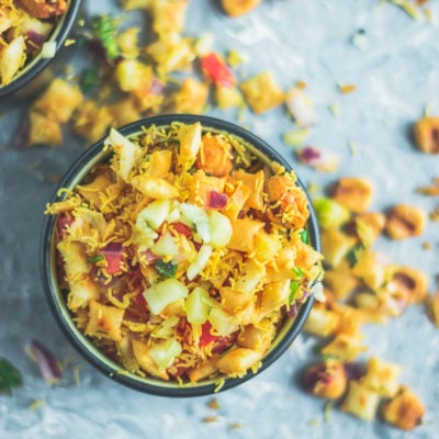 top angle shot of one bowl filled with 2 bowls containing Crispy & Masaledar Cheeselings Bhel
