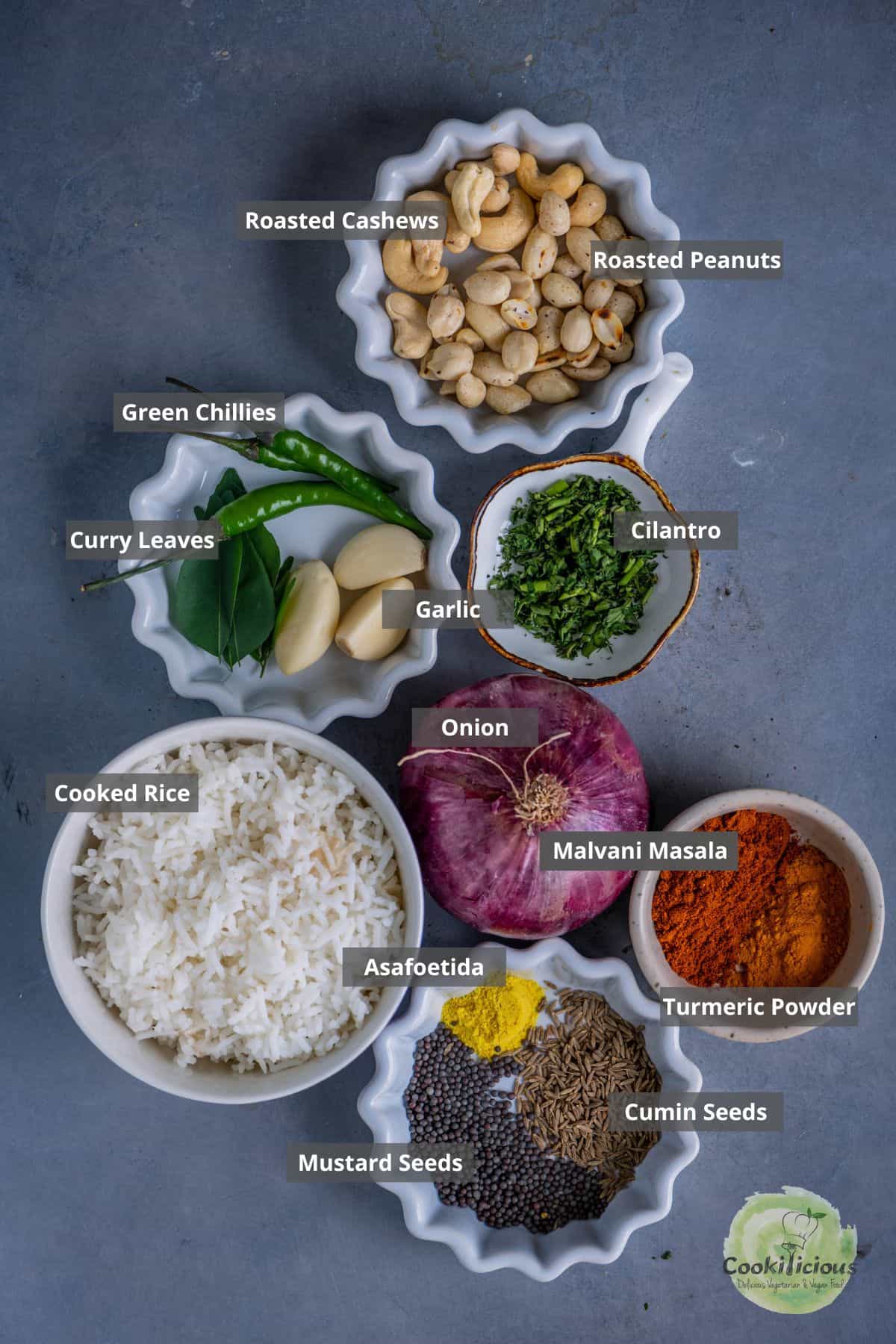 all the ingredients needed to make Indian seasoned rice called fodnicha bhat placed on a table with labels on them.