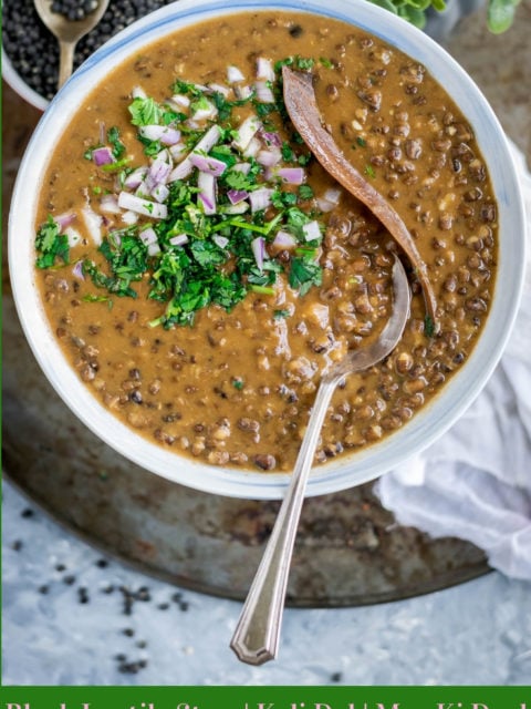 a bowl full of Black Lentils Stew | Kali Dal | Maa Ki Daal garnished with cilantro, onions and bay leaf and text at the bottom
