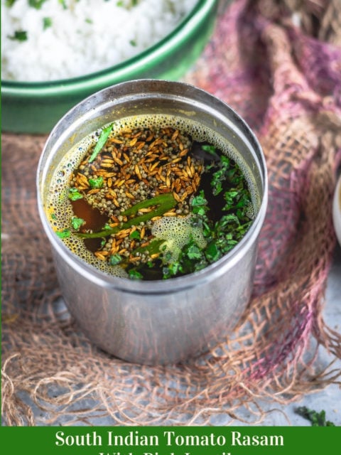 South Indian Tomato Rasam With Pink Lentils in a stainless steel vessel and text at the bottom