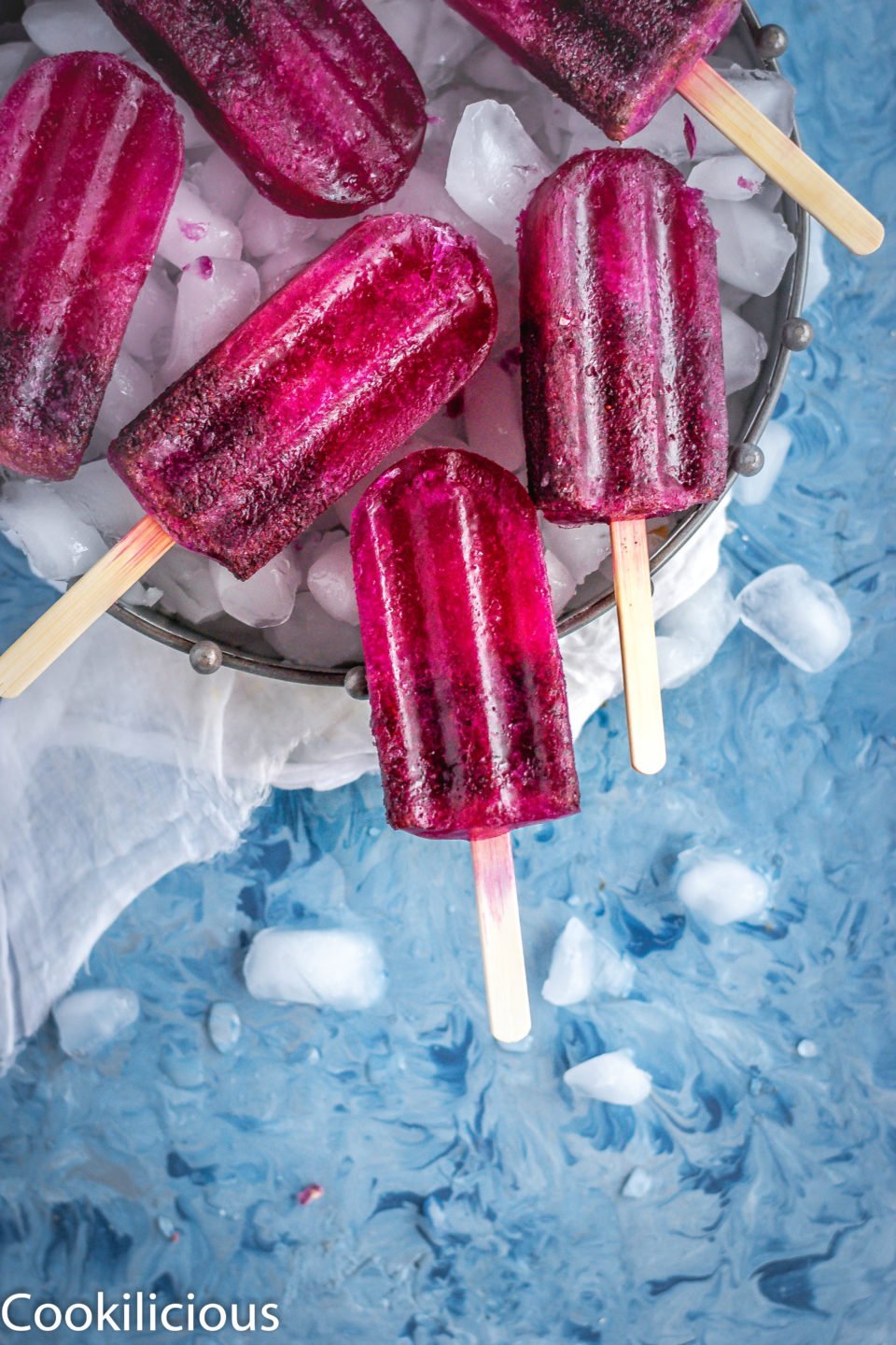 Masala Soda Blueberry Popsicles in a tray with ice cubes