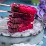 Masala Soda Blueberry Popsicles placed one on top of the other