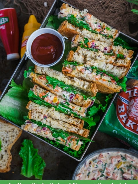 3 Indian Style Spiced Yogurt Sandwiches cut in half and placed in a tray with a ketchup in the middle and text at the bottom