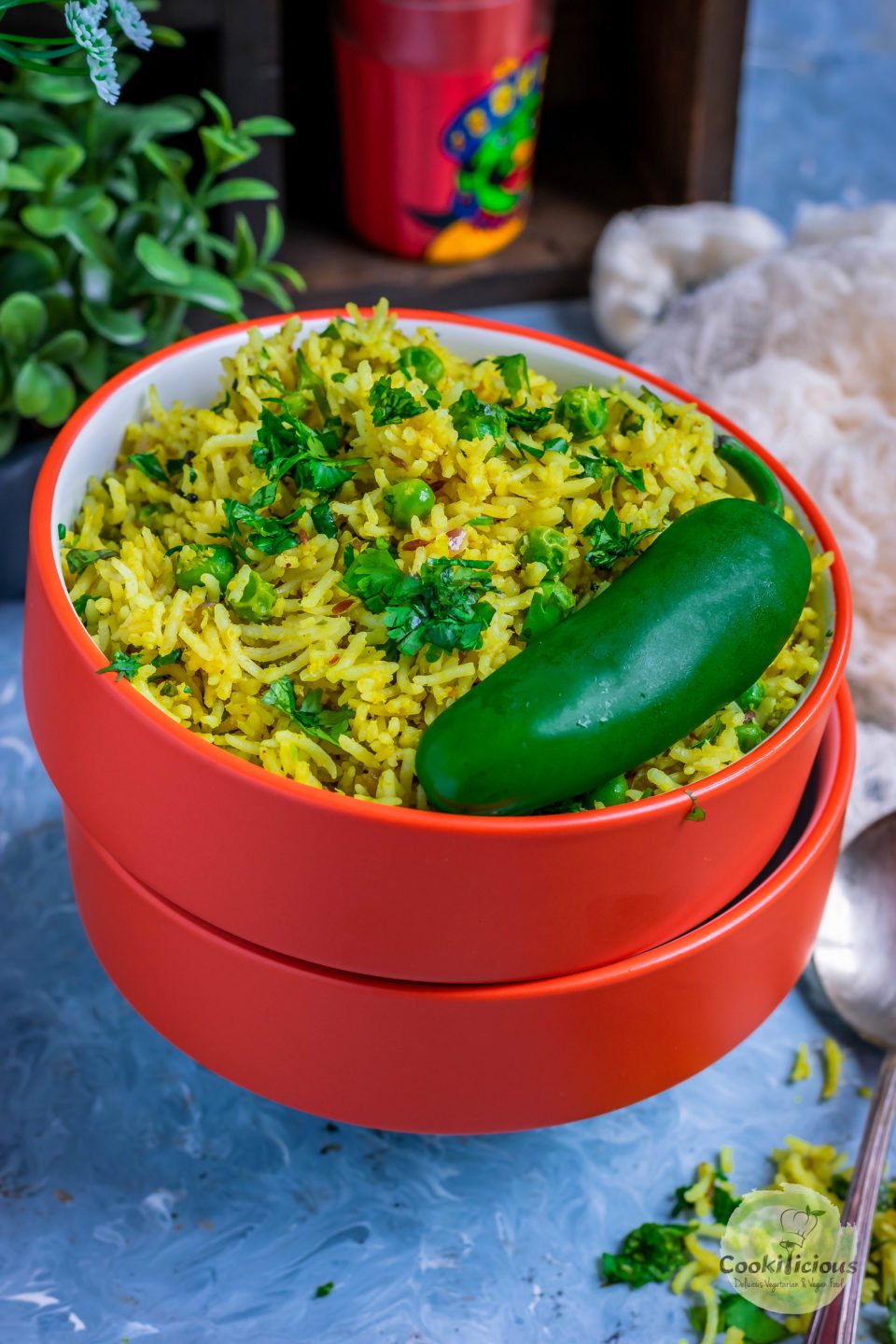 3 bowls one on top of the other and the top one filled with Green Peas Pulao