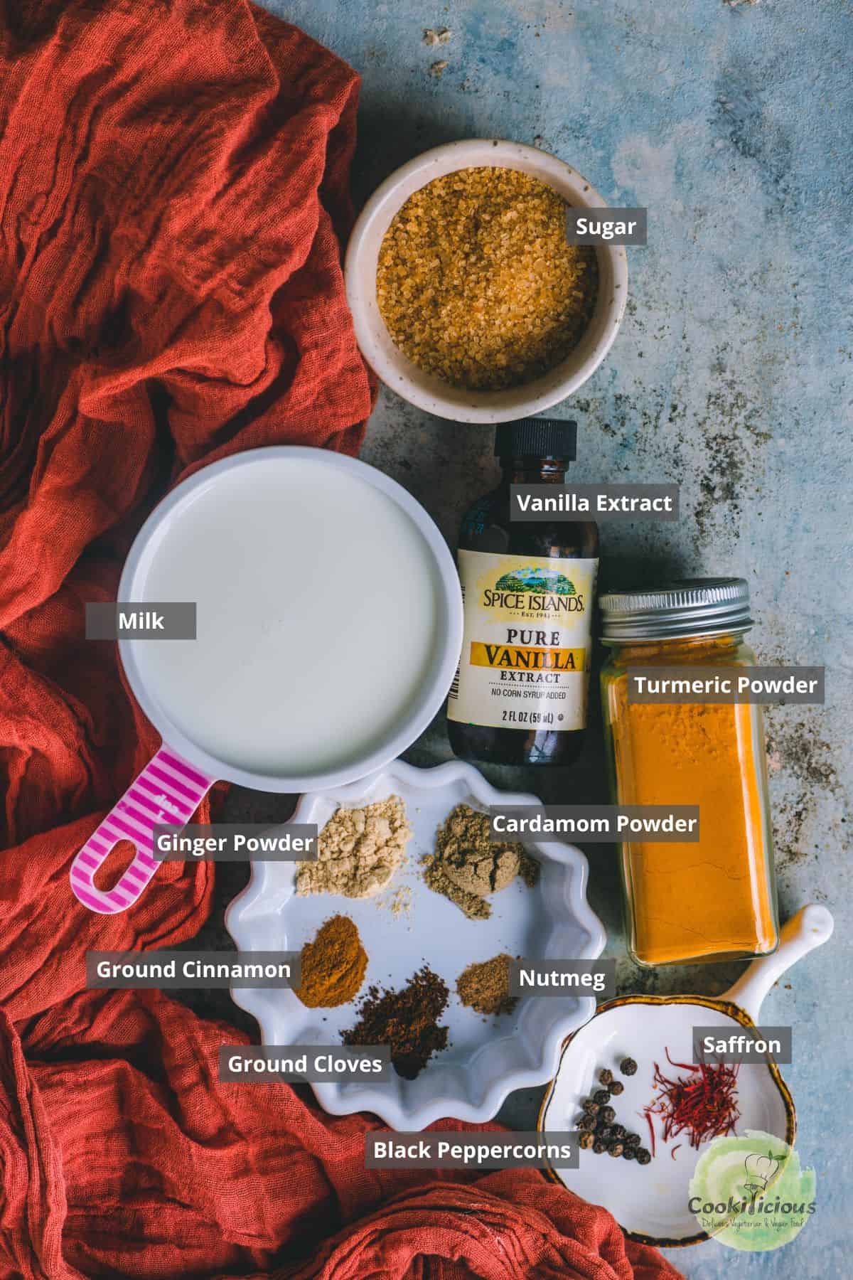 All ingredients needed to make Turmeric latte placed on a table with labels on them.