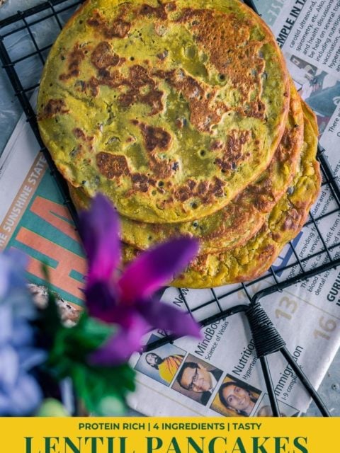 top view of Lentil Pancakes with Leftover Dal over a wire rack & text at the bottom
