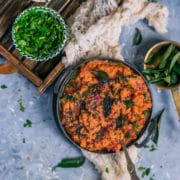 Instant Pot Beetroot Rasam Rice in a bowl with a bowl of dried cilantro on the side