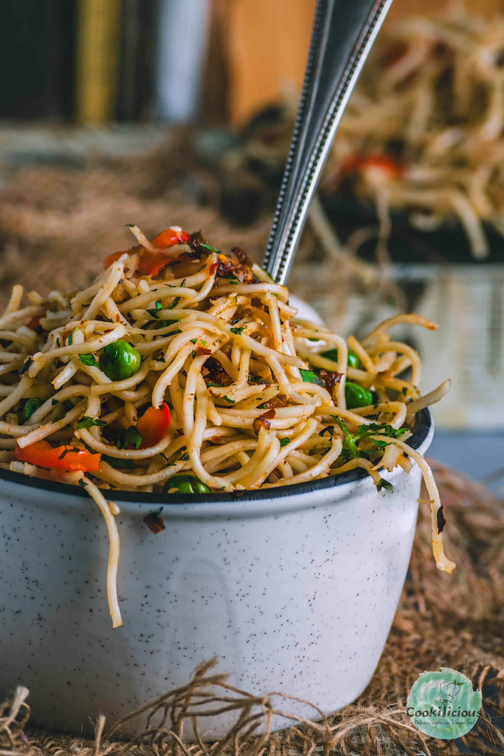 close up shot of Vegan Chili Garlic Noodles served in a bowl.