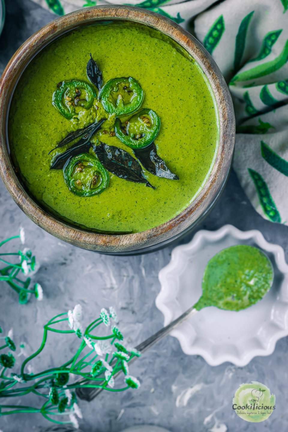 Mint Cilantro Chutney in a bowl with a spoon next to it