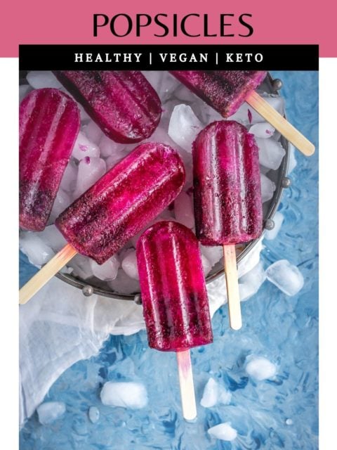 Masala Soda Blueberry Popsicles in a tray with ice cubes with text at the top