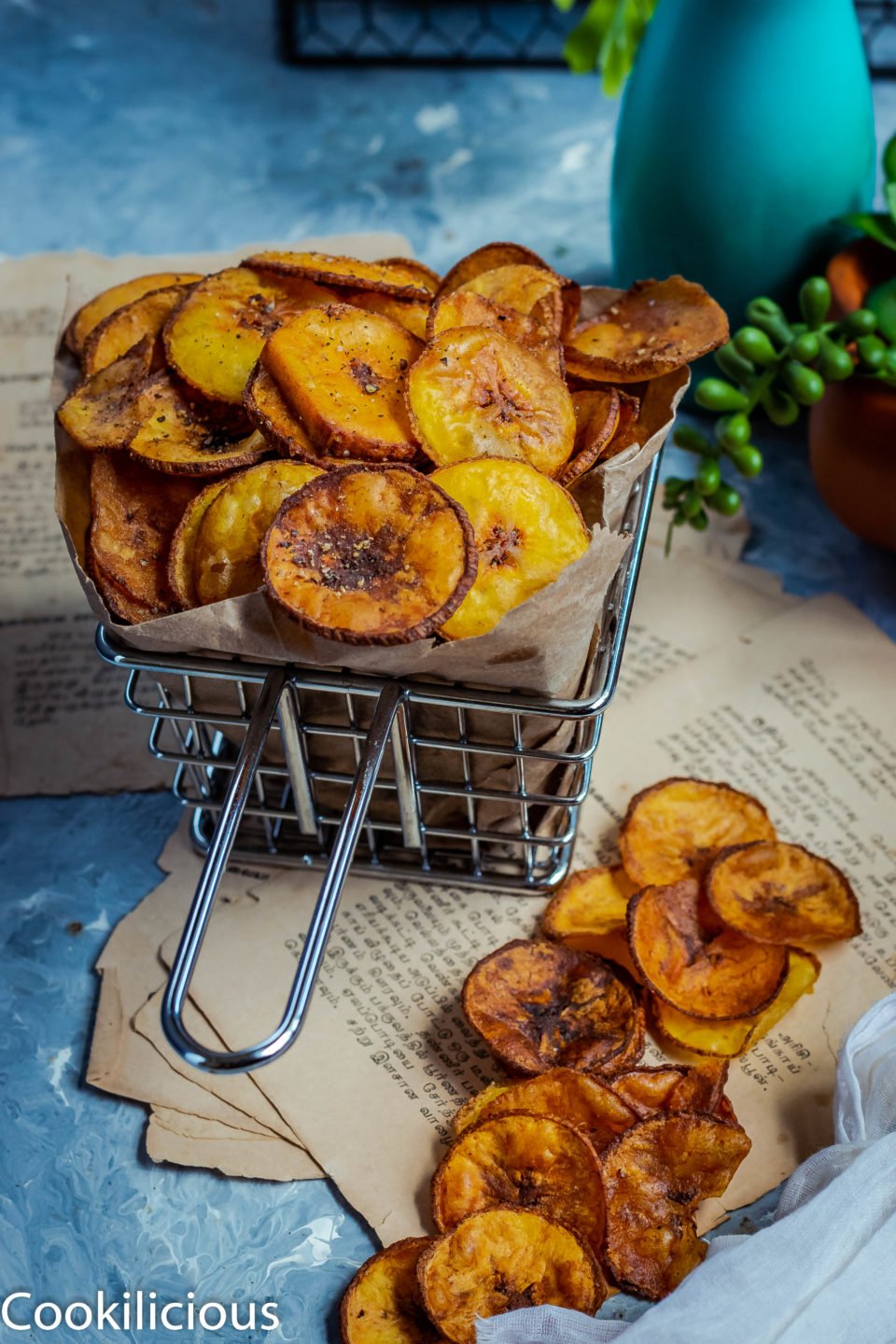 a basket filled with Fried Raw Banana Vegan Chips