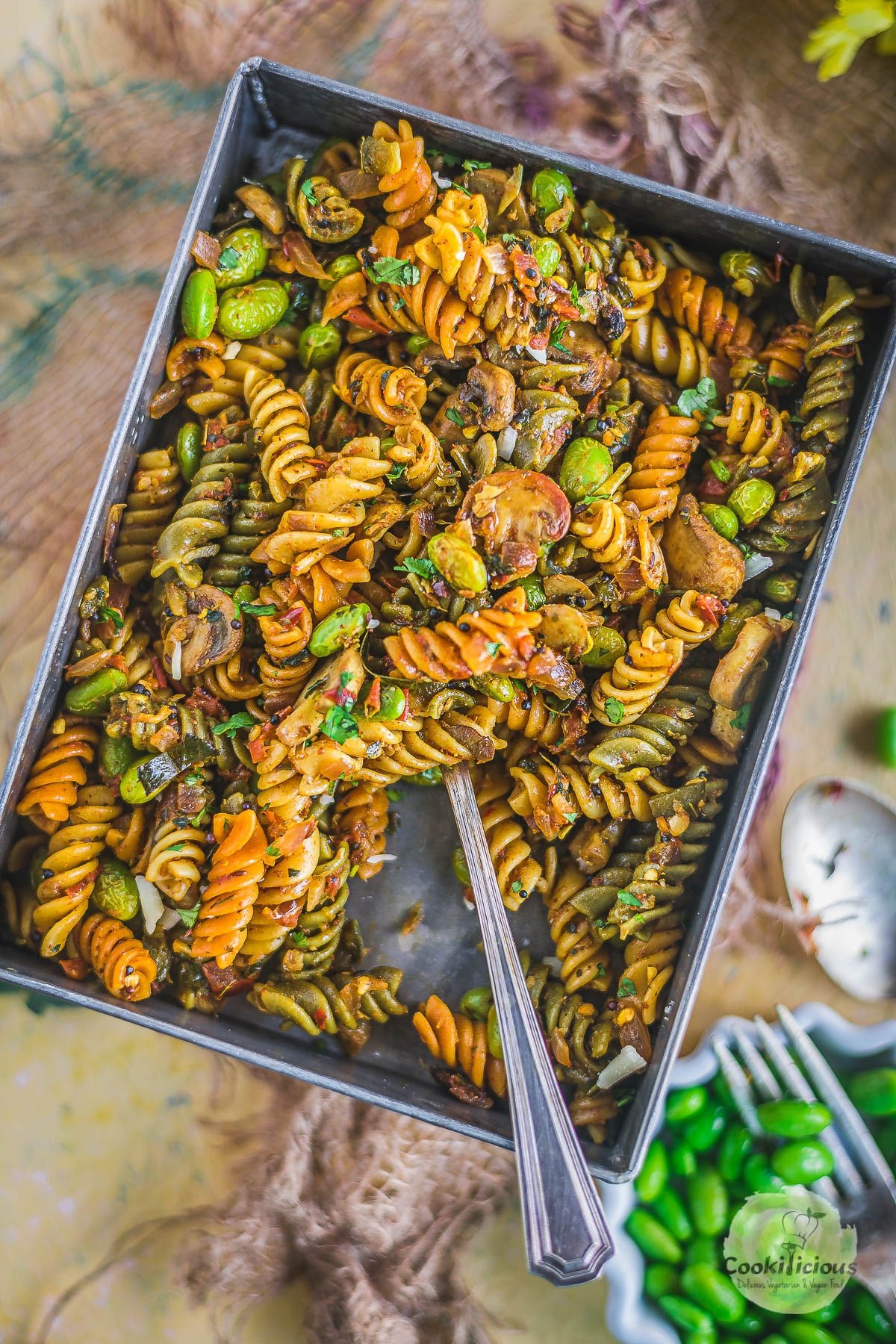 Indian Pasta Recipe | One-Pot Vegan Curry Pasta Dish in a rectangular bowl with a fork in it
