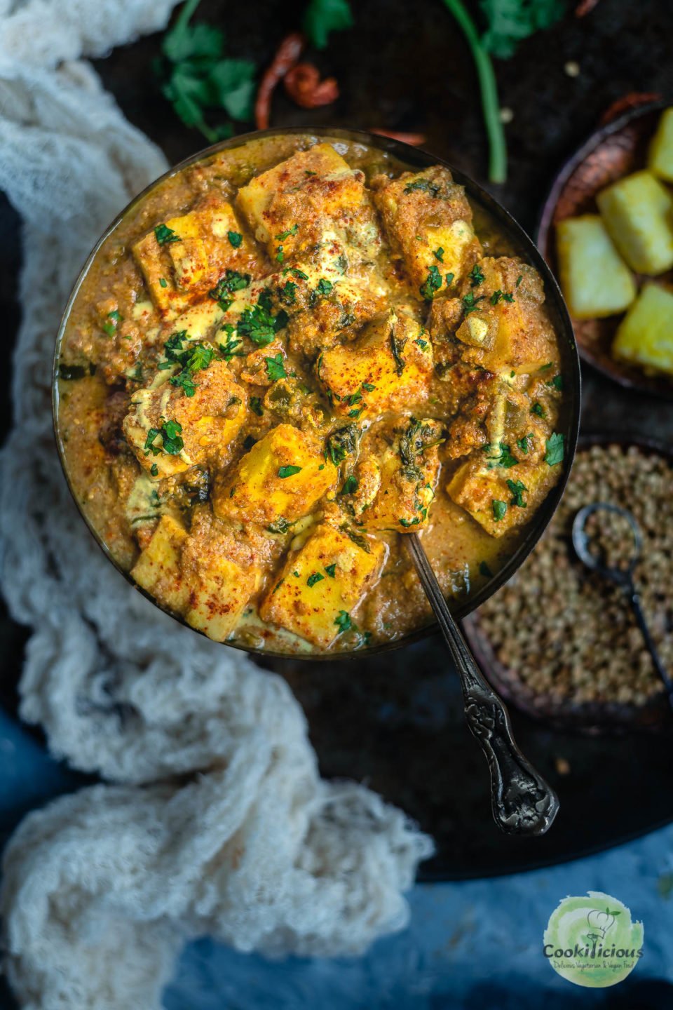 Kadai Paneer Curry in a bowl with a spoon in it