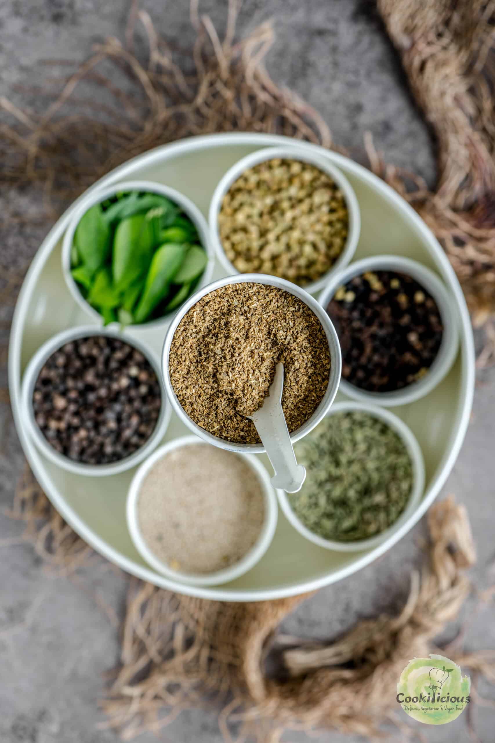 Homemade coriander powder stored in a masala dabba.