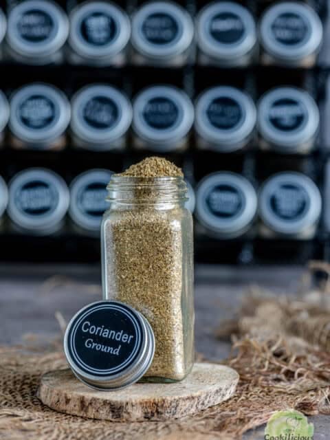 Coriander powder stored in a small glass jar.