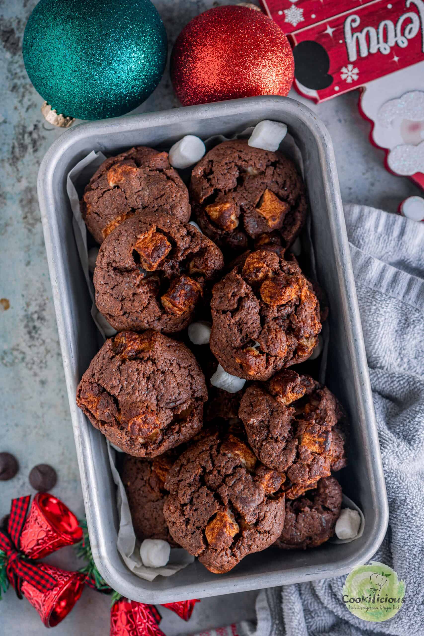 vegan marshmallow cookies with chocolate served in a cake tin.