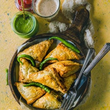 Vegetable Puff Pastry Samosa served with ketchup, chutney and chai.