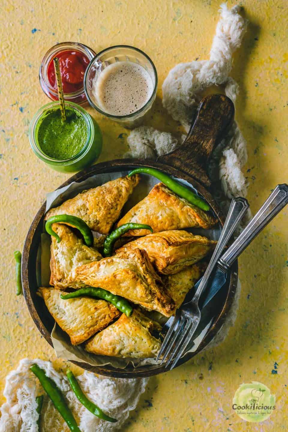 Vegetable Puff Pastry Samosa served with ketchup, chutney and chai.