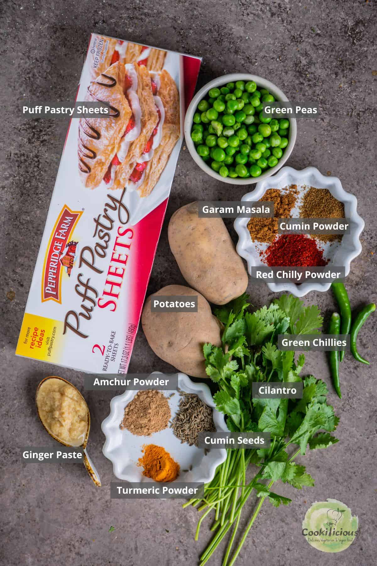 all the ingredients needed to make Samosa Puffs placed on a table with labels on them.