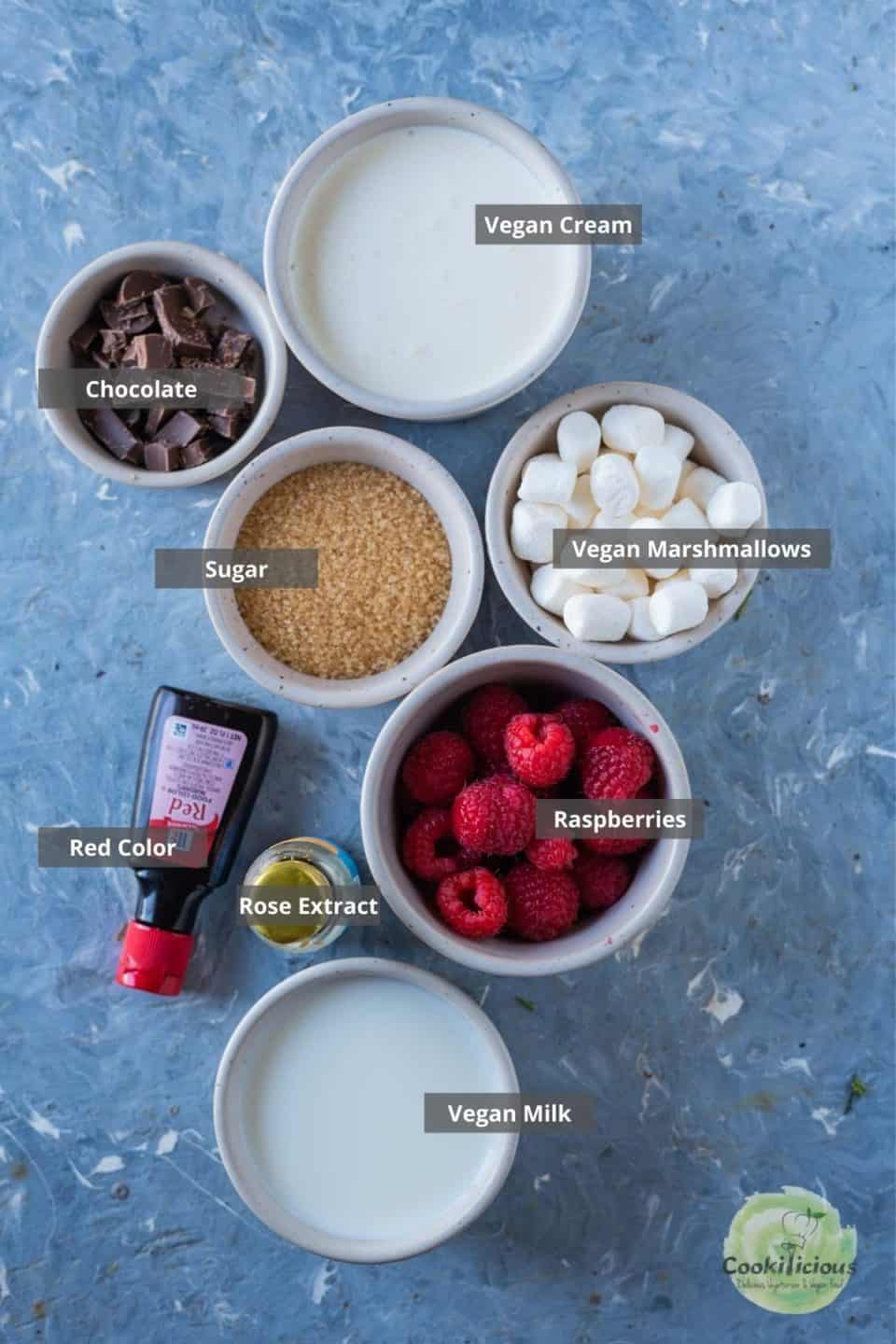 all the ingredients needed to make Vegan Raspberry Rose Hot Chocolate placed on a table with labels on them