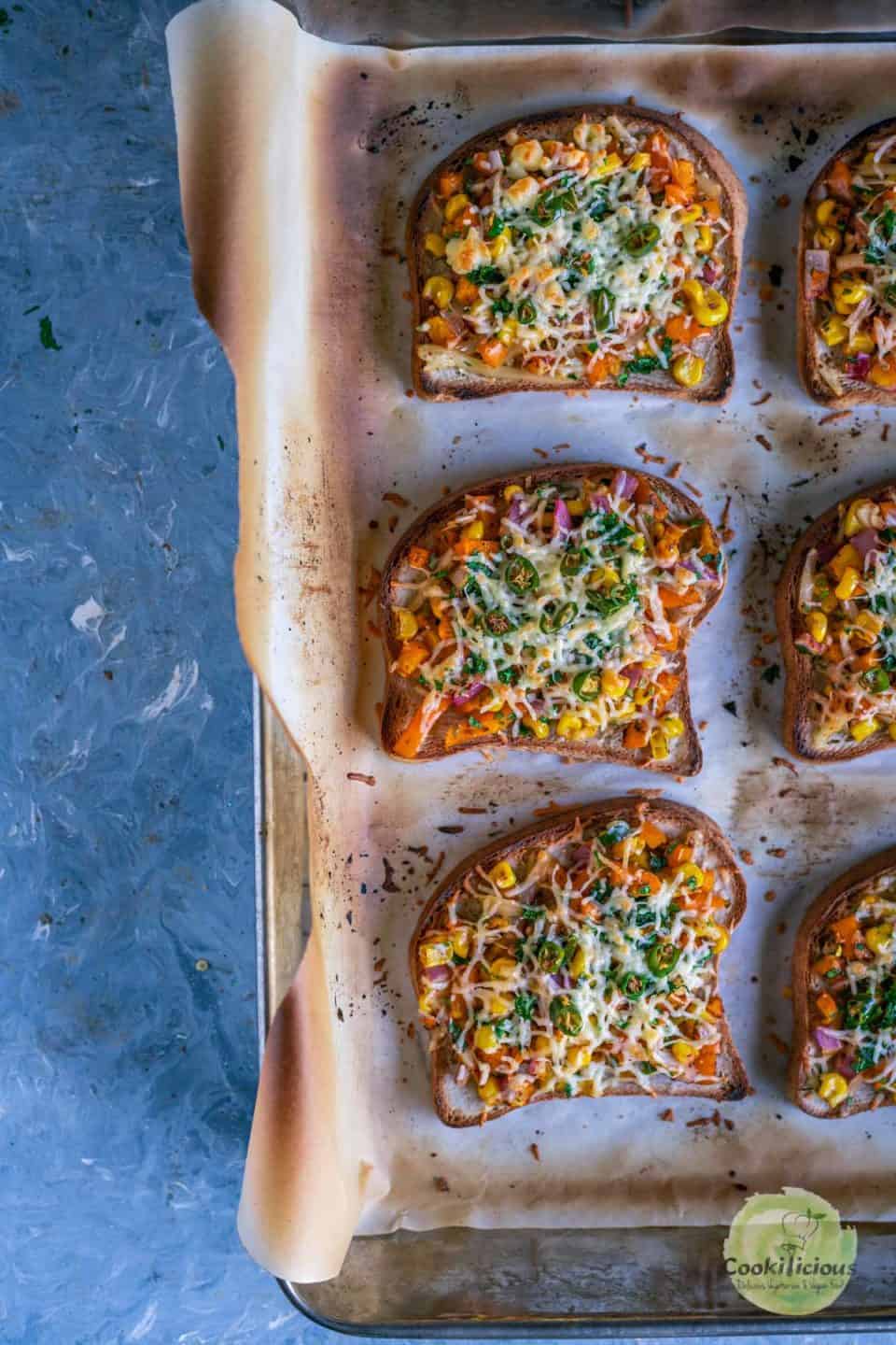 3 Vegan Chilli Cheese Corn Toast placed in a baking tray