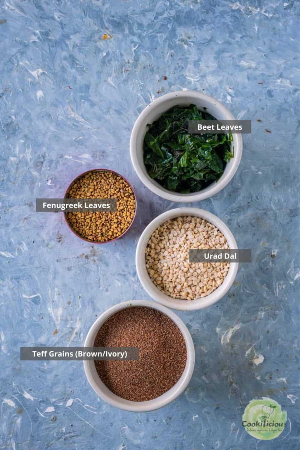 All the ingredients needed to make teff idli placed on a table with labels on them