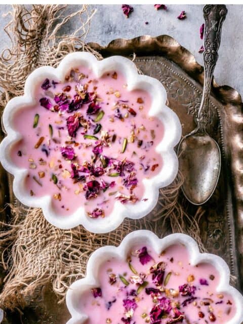 2 bowls of Basundi dessert served in a tray with a spoon on the side and text at the top.