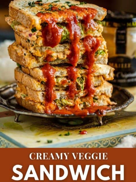 a stack of Veggie Sandwiches with red sauce over it and text at the bottom