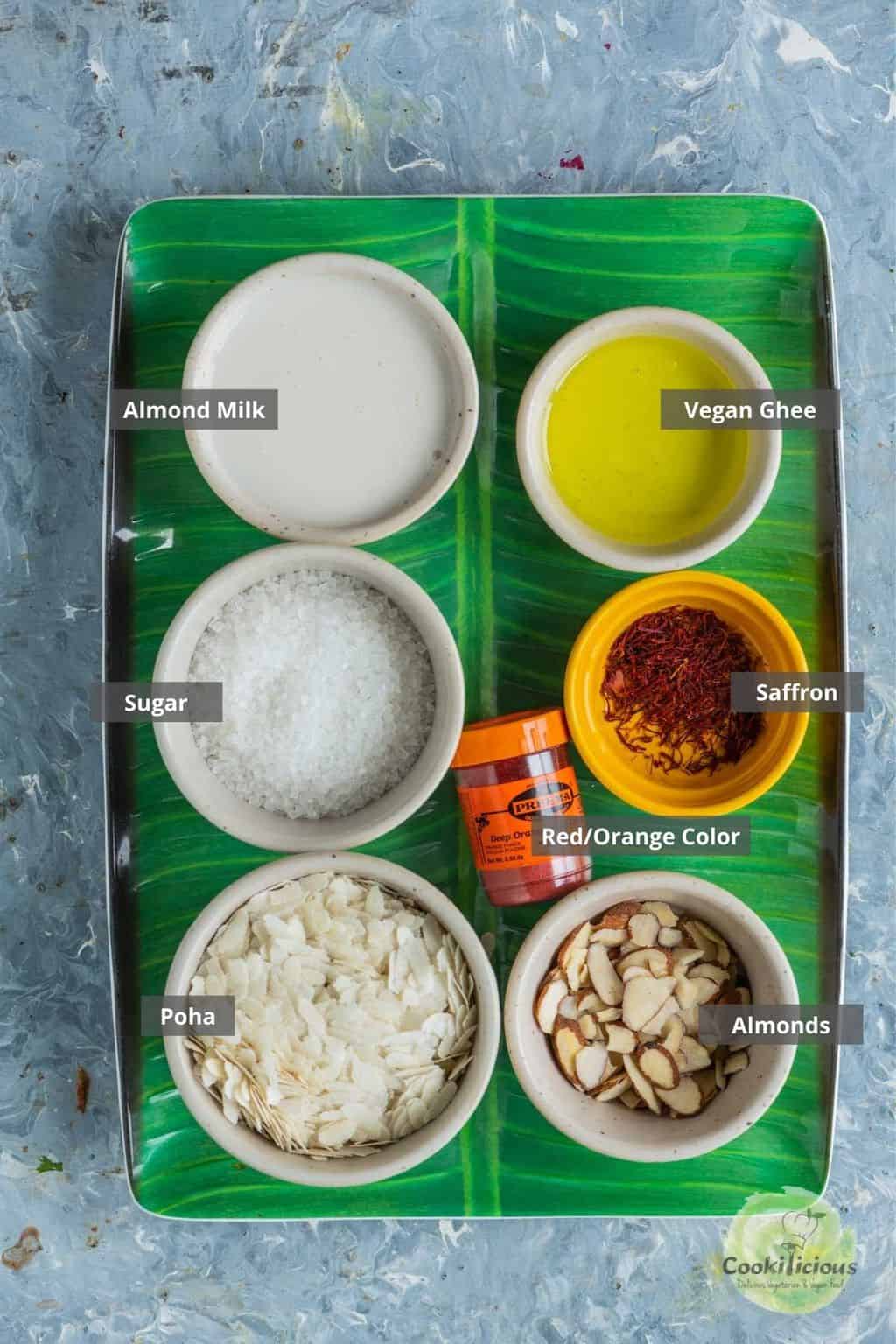 all the ingredients needed to make poha sheera placed on a tray with labels on them.