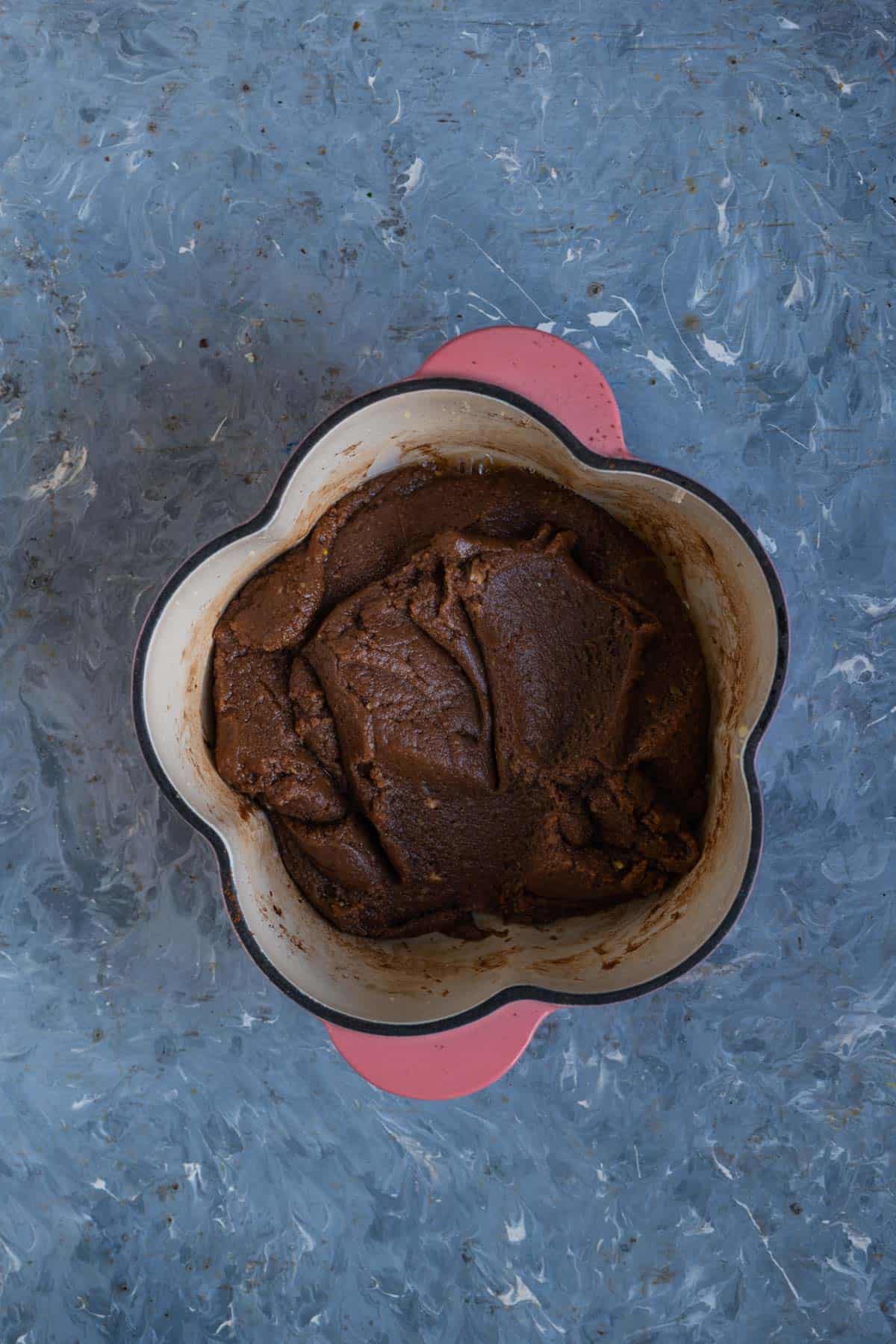 Chocolate khoya mixture coming together like a soft dough.