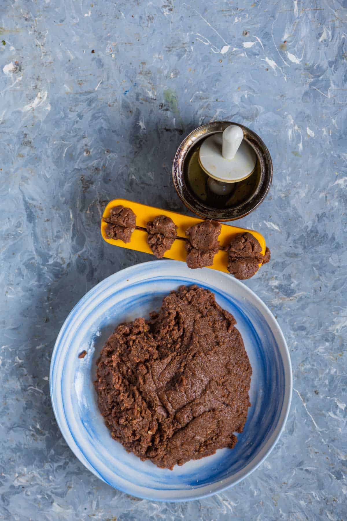Pressing the modak mold to shape the chocolate modaks.