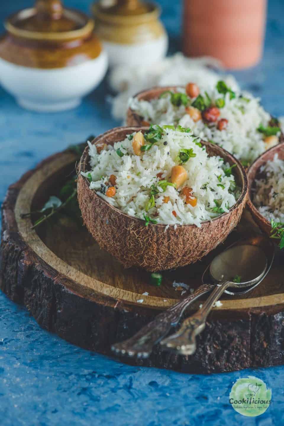 a coconut shell filled with South Indian Coconut Rice