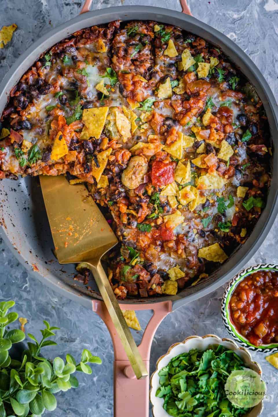 a serving spoon in a Vegan Mexican casserole